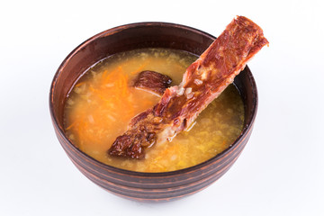 Pea soup with bacon on white