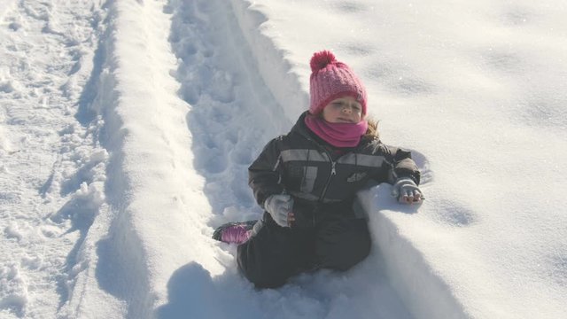 exhausted baby whine on snow background 