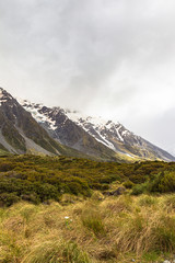 Valley in the Southern Alps among snow-capped mountains.  South Island, New Zealand