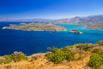Naklejka na ściany i meble Turquise water of Mirabello bay at the coastline of Crete, Greece