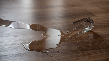 Spilled glass of water on a laminate