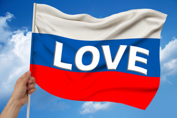 photo of the beautiful colored national flag of the modern state of Russia on textured fabric,...