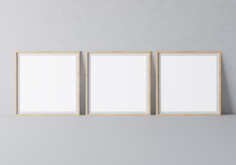 Square wooden empty frames in modern design on minimal gray background