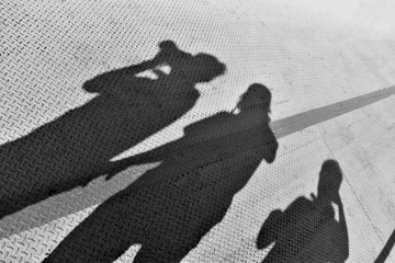 The shadow of people on the walkway