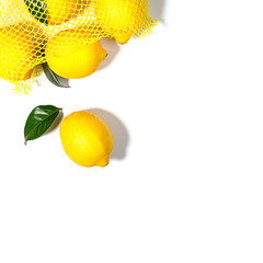 Creative layout made of yellow lemon with leaves on white color background.