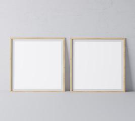 Square wooden empty frames in modern design on minimal gray background