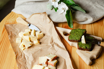 Assortment of cheese on a wooden background