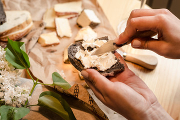 Assortment of cheese on a wooden background
