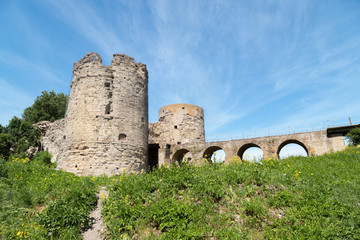 Fototapeta na wymiar Bridge and towers of the Koporye fortress on a nice summer day. Left viewLeningrad region, Russia
