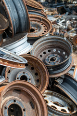 Old car metal wheel rims. Stacked in one stack