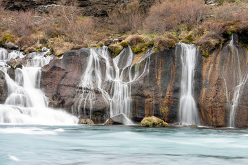 Hraunfossar waterfall cascade in the Reykholt area in Iceland. Travelling, nature and holiday concept.