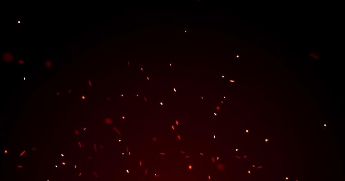 Fire sparks and red flame sparkles, red light glitter, particles on black background. Golden yellow and red glowing fire flame sparks and heat blaze glittery flares shine