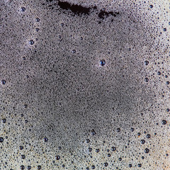 Background from coffee foam with bubbles.