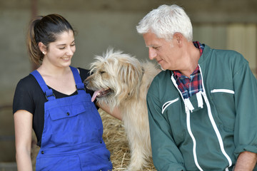 Portrait of farmers and dog
