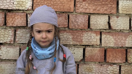Grumpy child. Orphanage life and little girl. 