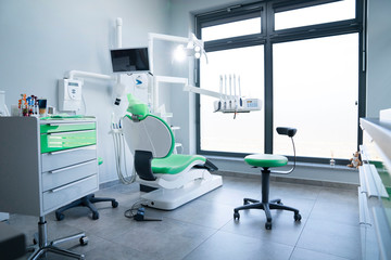 Modern dental practice. Dental chair and other accessories used by dentists.