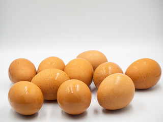 Egg are place closely on the white floor and background (no social distancing)