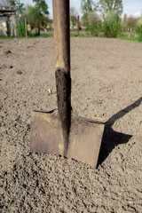 Digging spring soil with shovel. Close-up. Shovel on the ground, concept of gardening.