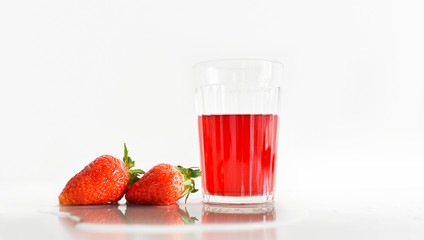 fresh strawberry glass with red juice on a white background