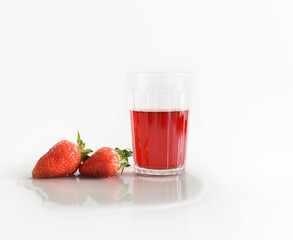 fresh strawberry glass with red juice on a white background
