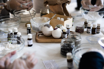 hands of a woman making Bath Bomb