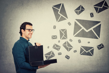 Businessman opens briefcase filled with different messages as lots of envelope symbols comes out of the box. Ingenious boss shares creativity and experience, sending multiple letter news to employees.