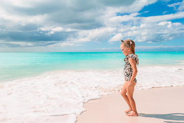 Fototapeta na wymiar Cute little girl at beach during caribbean vacation