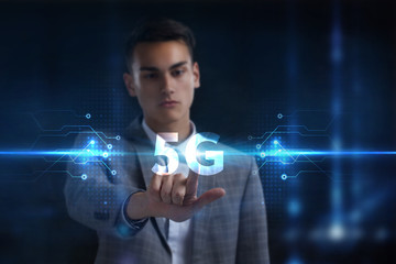 Business, Technology, Internet and network concept. Young businessman working on a virtual screen of the future and sees the inscription: 5G