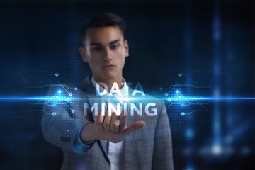 Business, Technology, Internet and network concept. Young businessman working on a virtual screen of the future and sees the inscription: Data mining