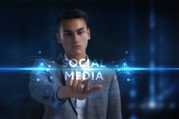 Business, Technology, Internet and network concept. Young businessman working on a virtual screen of the future and sees the inscription: Social media