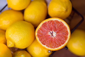 The preparation of lemonade. Lemons in a basket outdoors