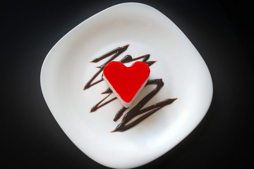 Freshly baked aromatic cake on a white plate.