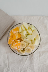 
sliced ​​fruit in a plate, proper breakfast