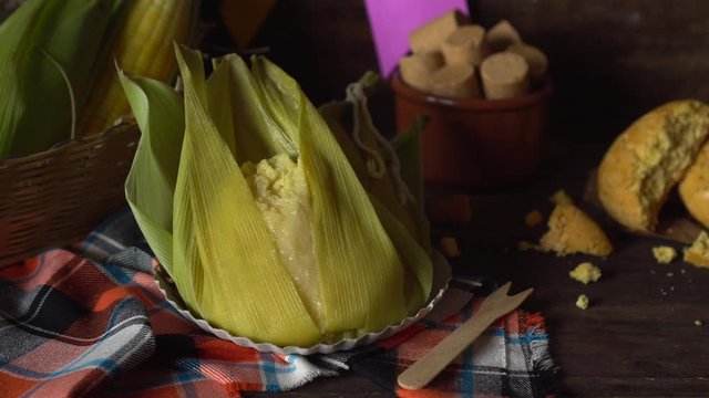 Brazilian typical "pamonha", corn cob and pacoca" june party "festa junina" slider back and forth 4k