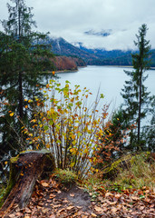 Alpine  Sylvenstein Stausee lake on Isar river, Bavaria, Germany. Autumn overcast, foggy and...