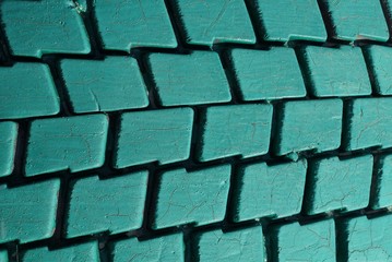 green plastic texture from an old dirty car tire with cracks