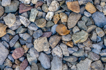 Many kind of stones in different colors and and sizes and shapes, background pattern