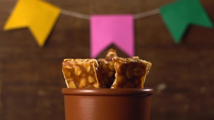 Brazilian typical peanut brittle "pe de moleque" rotating june party "festa junina" 4k