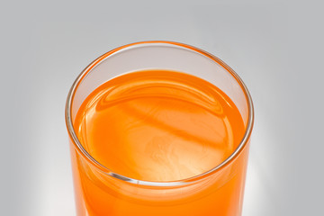 Orange juice, close up on white