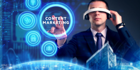 Business, Technology, Internet and network concept. Young businessman working on a virtual screen of the future and sees the inscription: Content marketing