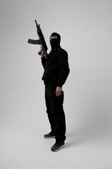 Man in mask With gun on white background