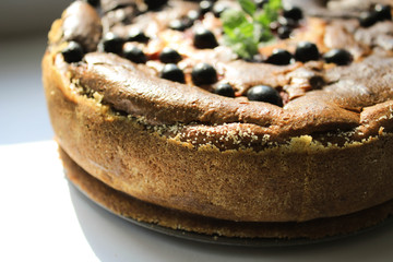 Pie with berries on the windowsill