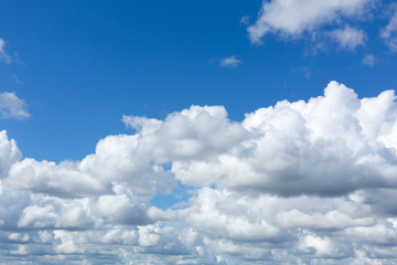 Incredibly beautiful fluffy clouds on a sunny spring day.