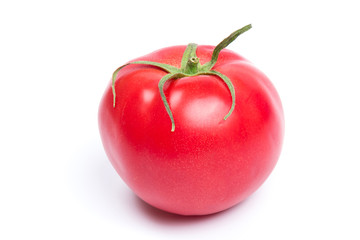 Red fresh tomato isolated on white background in close-up