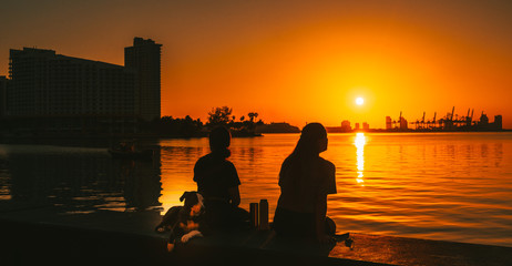 sunset aquatic silhouette people women sun sea ocean sky river city building lake dog boat dusk sunrise nature pair horizon people summer sitting © Alberto GV PHOTOGRAP