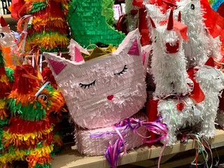 Colorful pinatas used in birthdays and Mexican celebrations, filled with candy and sweets. Pinata is a famous game from the South American region (Mexico).