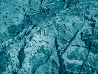 Beautiful turquoise abstract background. Toned rock texture. Close-up. Marble effect. Blue green stone background.