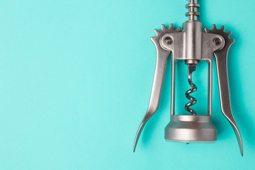 Corkscrew on a blue background with copyspace.