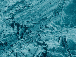 Beautiful turquoise abstract background. Toned rock texture. Close-up. Marble effect. Blue green stone background.