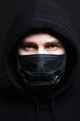 Man in Mask and Hood. Covid-19